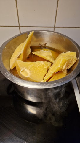 Chopped pieces of wax being melted